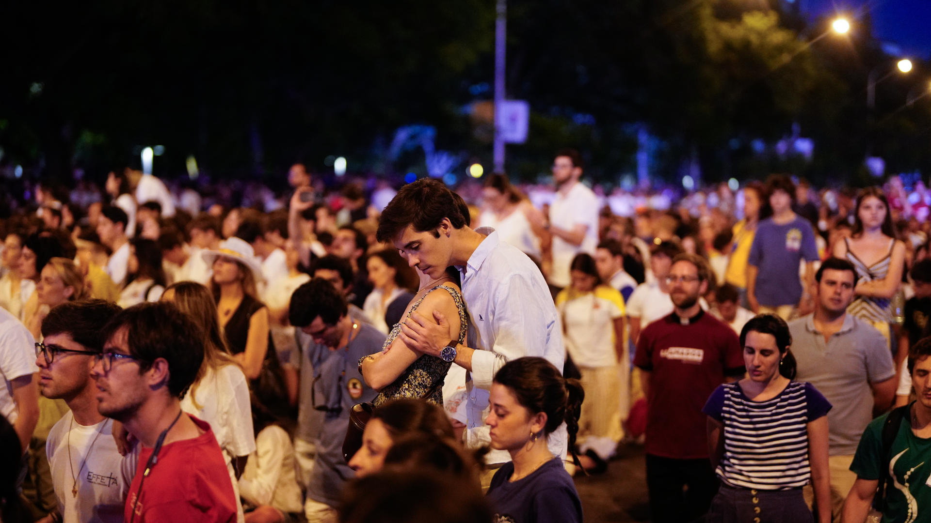 Pope Leo XIV speaking to a vast assembly of young people in an outdoor plaza.